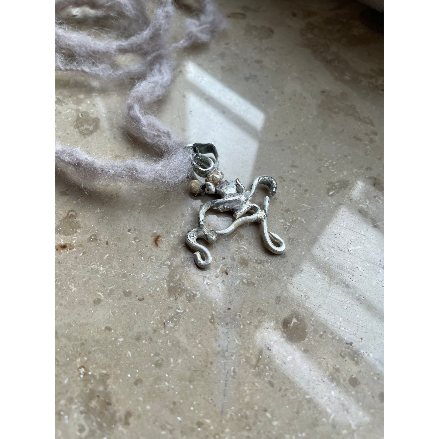 swirly silver necklace